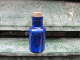 Round Antique French blue bottle.