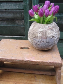 Old wooden stool with handle.