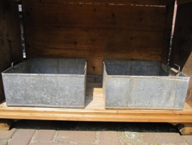 Old galvanized rectangular container with two handles on the inside