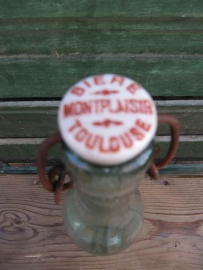 Old beer bottle with bracket