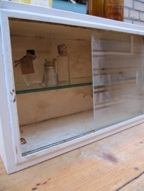 Brocante wooden medicine cabinet with glass sliding door