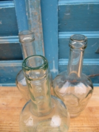 Set of 3 glass almost identical old bottles