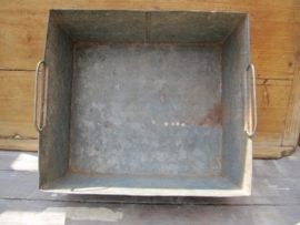 Old galvanized rectangular container with two handles on the inside