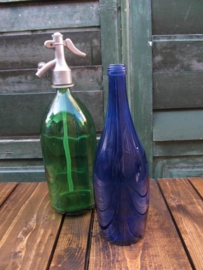 Old seltzer soda bottle in green