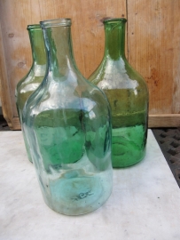 Ancient brocante green bottle with narrow neck.
