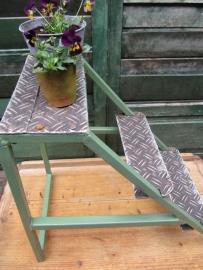 Old industrial metal ladder or stool