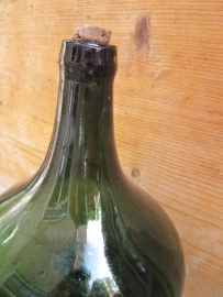 Old green bottle with cork