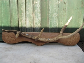 Nice part of a deer antler on shelf
