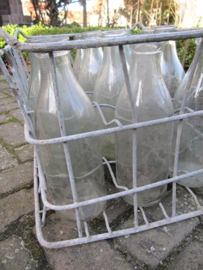 Old brocante crate with 12 milk bottles of 1 liter.