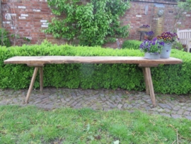 Old natural colour wooden bench.