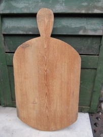 Cute long cutting board with rounded corners.
