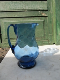 Ancient brocante blue glass water, lemonade or wine jug