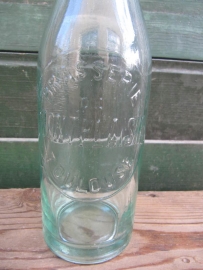 Old beer bottle with bracket