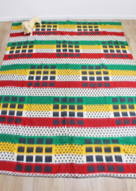 Kleurrijke vintage deken, geel -groen -rood. Retro sprei / plaid