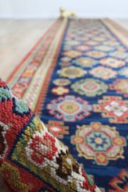 Lange vintage loper met Oosters decor. Wollen Boho tapijt / kleed