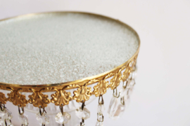 Glazen boudoir bijzettafeltje met gouden details. Vintage plantentafel