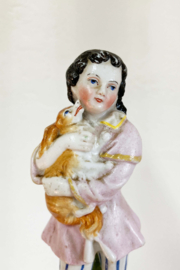 Set van 2 beeldjes van kinderen met hondjes.  Keramieken vintage ornamenten