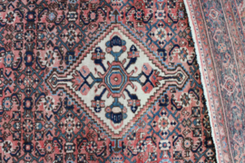 Handgeknoopt Oosters kleed rozig/rood. Uniek vintage tapijt