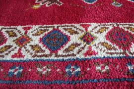 Handgemaakt boho vloerkleed in rood tinten. Vintage Smyrna tapijt.