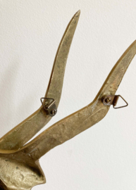 Set goudkleurige vogels. Vintage messing zwaluwen voor aan de muur