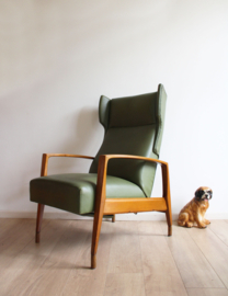 Toffe groene vintage fauteuil. Retro design stoel met relax stand