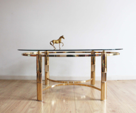 Hollywood Regency style salontafel. Glazen tafel op gouden messing poten.