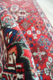 Handgemaakt vintage vloerkleed. Oosterse rode loper / deurmat