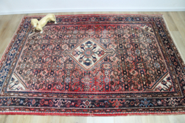 Handgeknoopt Oosters kleed rozig/rood. Uniek vintage tapijt