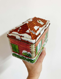 Vintage kerstblik in huisjesvorm. Retro blikken huisje