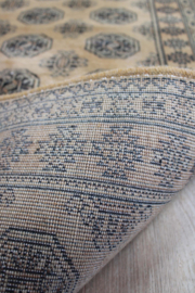 Bruine vintage loper met Oosters decor. Lang wollen Boho tapijt / kleed