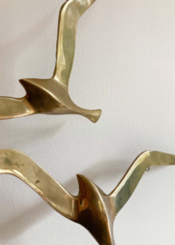 Set goudkleurige vogels. Vintage messing zwaluwen voor aan de muur