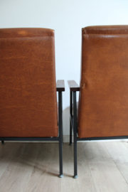 Set cognac kleurige vintage stoelen. Retro design fauteuils.