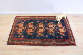Uniek vintage tapijt. Handgeknoopt Oosters kleedje blauw/oranje
