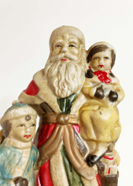 Vintage kerstmannen beeldje met kinderen. Keramieken retro Santa Clause