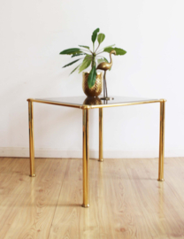 Glazen salontafel op gouden poten. Vintage bijzettafel - Hollywood Regency stijl.