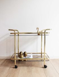 Gouden vintage trolley / bijzettafel met rookglazen bladen. Vintage sidetable