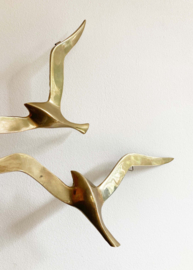 Set goudkleurige vogels. Vintage messing zwaluwen voor aan de muur