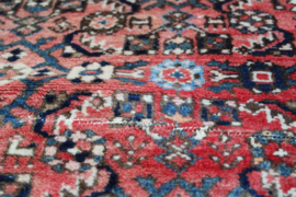Handgeknoopt Oosters kleed rozig/rood. Uniek vintage tapijt