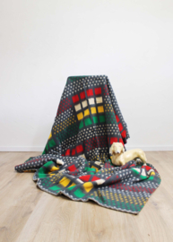 Kleurrijke vintage deken, geel -groen -rood. Retro sprei / plaid