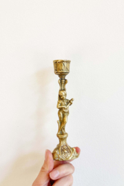 Goudkleurige kandelaar met muzikant. Vintage kandelaartje messing/brons?