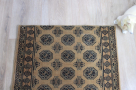 Bruine vintage loper met Oosters decor. Lang wollen Boho tapijt / kleed