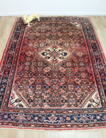 Handgeknoopt Oosters kleed rozig/rood. Uniek vintage tapijt