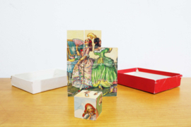 Vintage puzzel: Assepoester. Retro blokken / blokpuzzel in doos