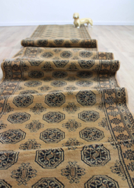 Bruine vintage loper met Oosters decor. Lang wollen Boho tapijt / kleed