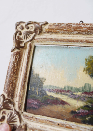 Klein schilderijtje van een heide landschap. Olieverf schilderij in barok lijst