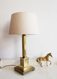 Goudkleurige Herda lamp met beige kap. Vintage tafellamp