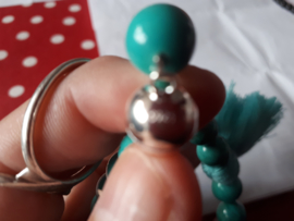 Turquoise howliet met kwast