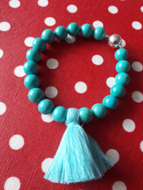 Turquoise howliet met kwast