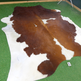 Brown & white cowhide rug (240 x 220)