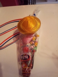 Medaille van chocolade + snoepzakje